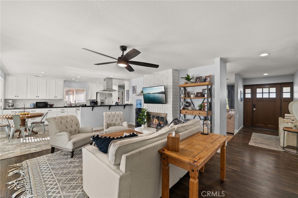 18165 Mariposa Avenue Riverside, CA 92508 - Photo 8 of 59 a living room with furniture and kitchen view