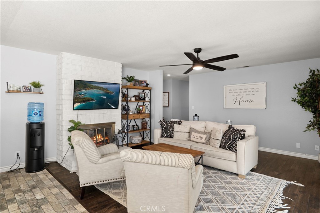 18165 Mariposa Avenue Riverside, CA 92508 - Photo 9 of 59 a living room with furniture and a flat screen tv
