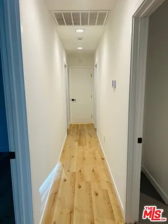 a bathroom with a sink mirror vanity and toilet