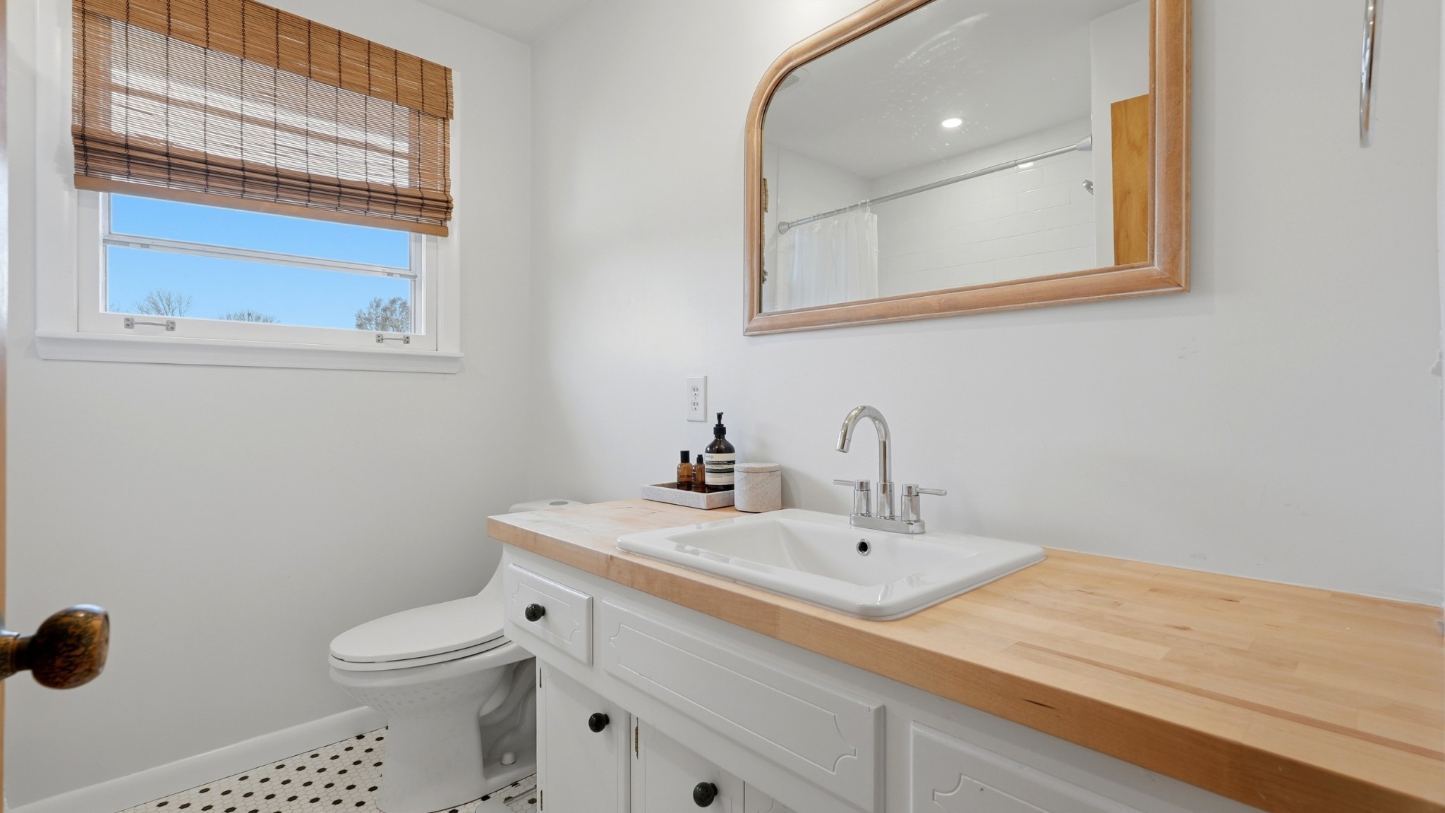 7524 Gary Road Joelton, TN 37080 - Photo 13 of 39 a bathroom with a toilet sink and mirror