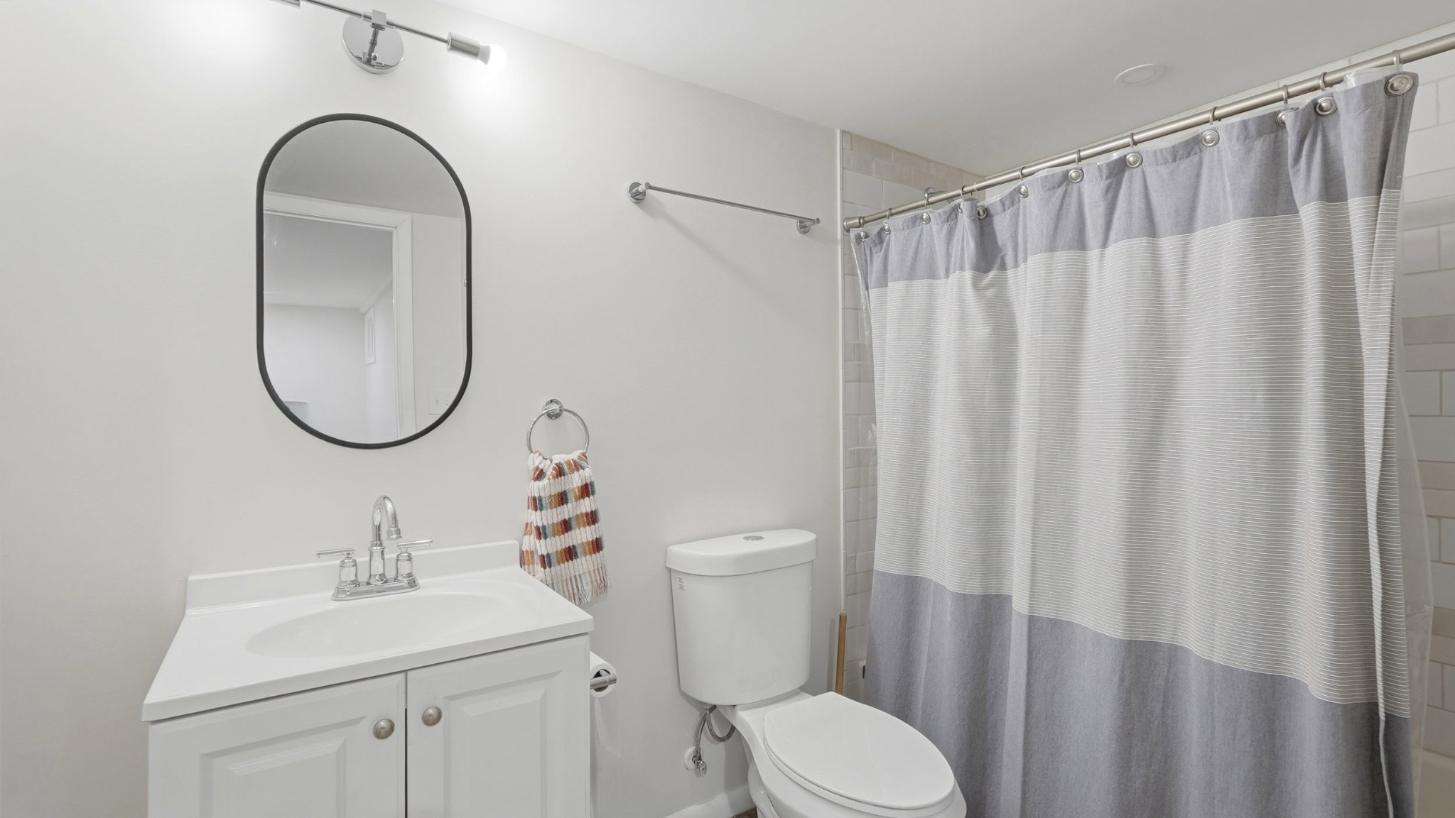 7524 Gary Road Joelton, TN 37080 - Photo 24 of 39 a bathroom with a toilet a sink and a mirror