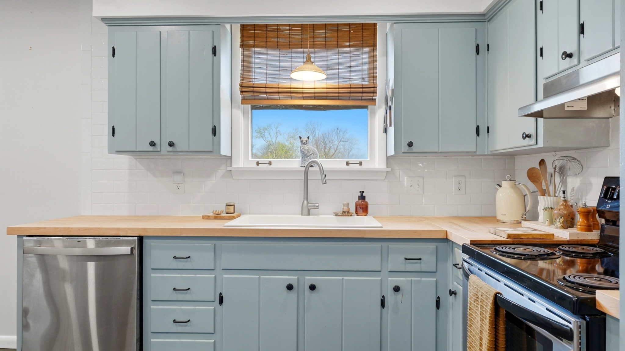 7524 Gary Road Joelton, TN 37080 - Photo 9 of 39 a kitchen with stainless steel appliances a stove a sink and a refrigerator
