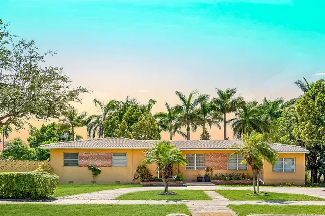 front view of a house with a yard