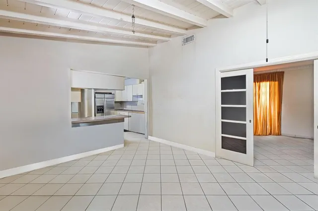 a kitchen with a sink stove and refrigerator