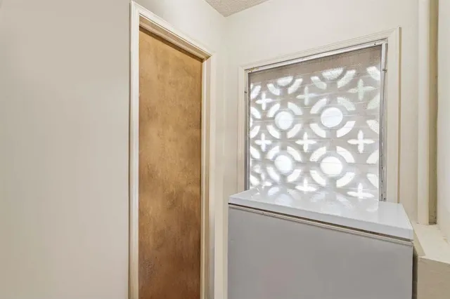 a view of an empty room with a window