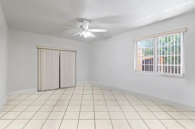 a bathroom with a sink a mirror a toilet and a shower