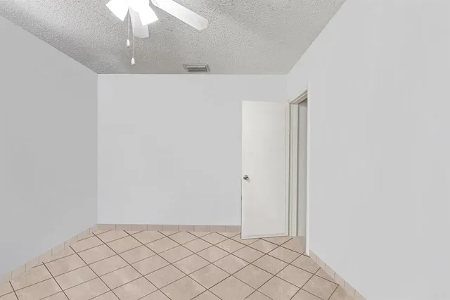 a view of a livingroom with a chandelier fan
