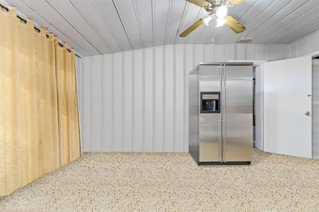 a view of a backyard with sitting area