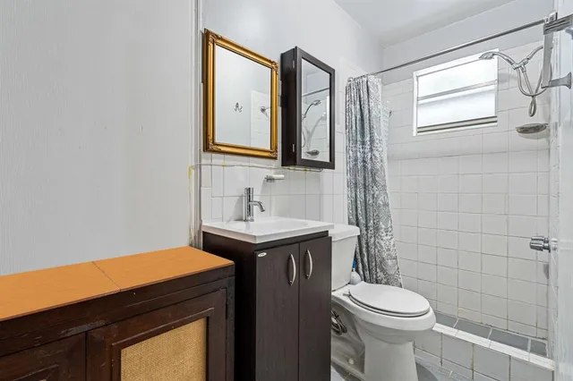 a view of a house with a yard and furniture