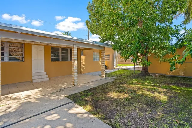 a view of a backyard with a garden and plants
