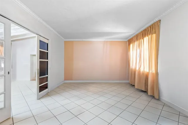 a view of an empty room and window