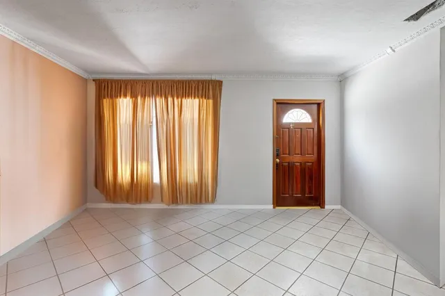 a view of an empty room and window