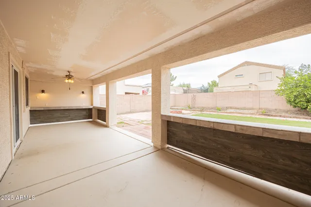a view of an empty room and a window