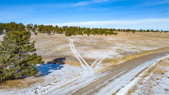 a view of a lake with sunset