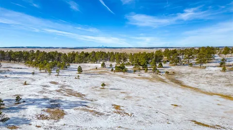 a view of mountain view with lots of trees
