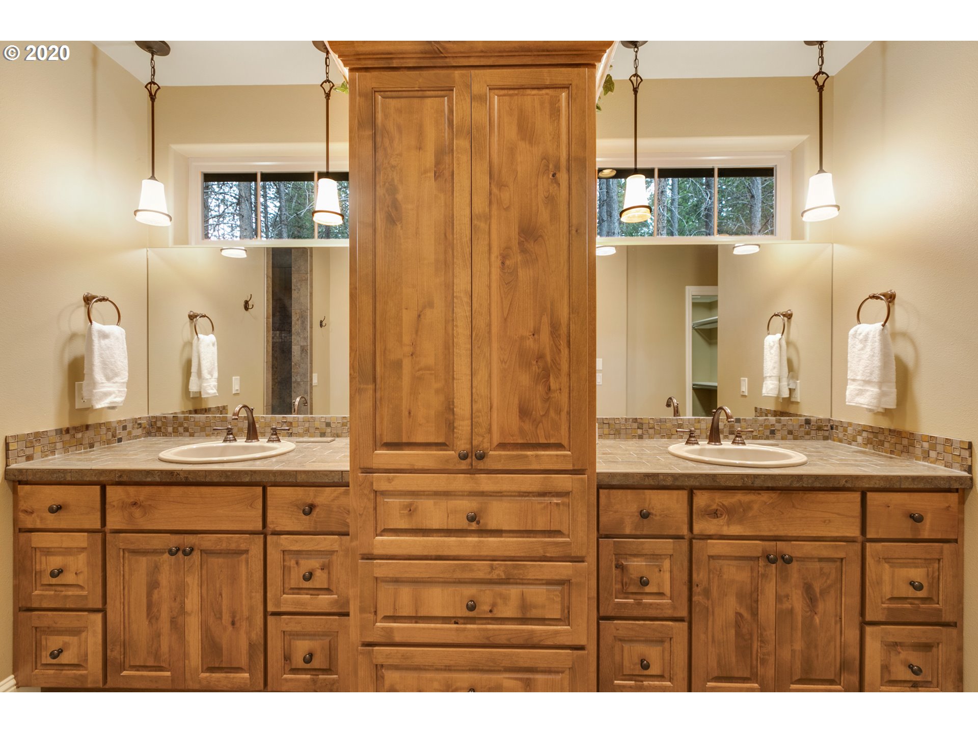 16767 Stage Stop Drive Bend, OR 97707 - Photo 13 of 26 a bathroom with a sink a mirror and a