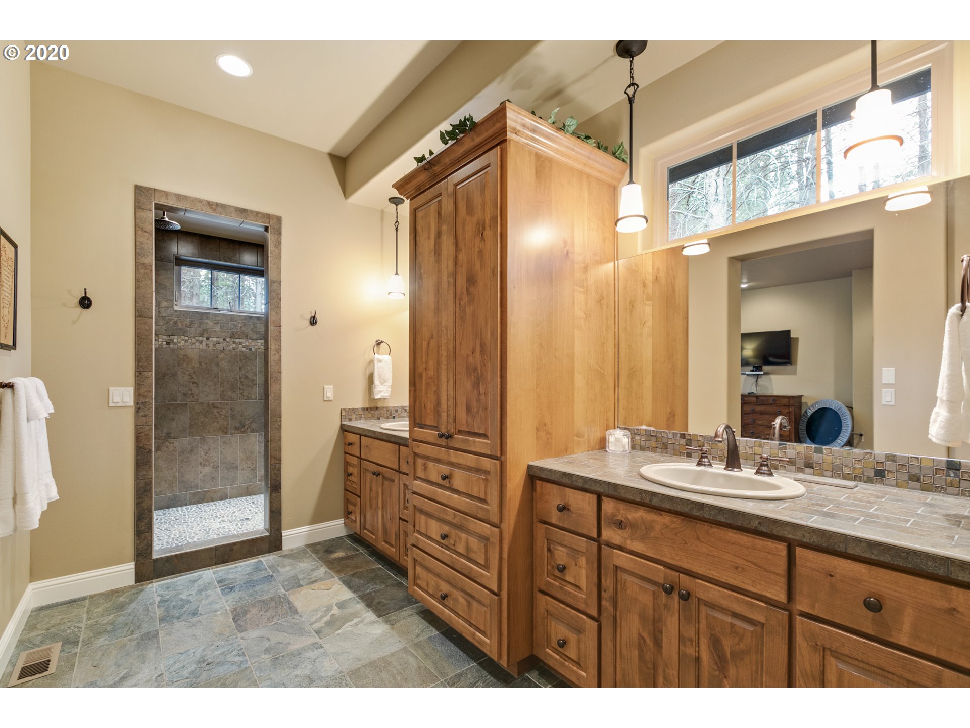 16767 Stage Stop Drive Bend, OR 97707 - Photo 14 of 26 a bathroom with a sink and a mirror