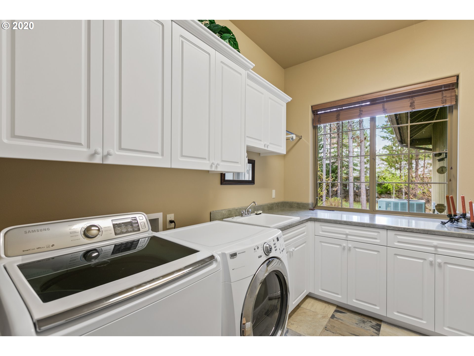 16767 Stage Stop Drive Bend, OR 97707 - Photo 16 of 26 a utility room with dryer and washer