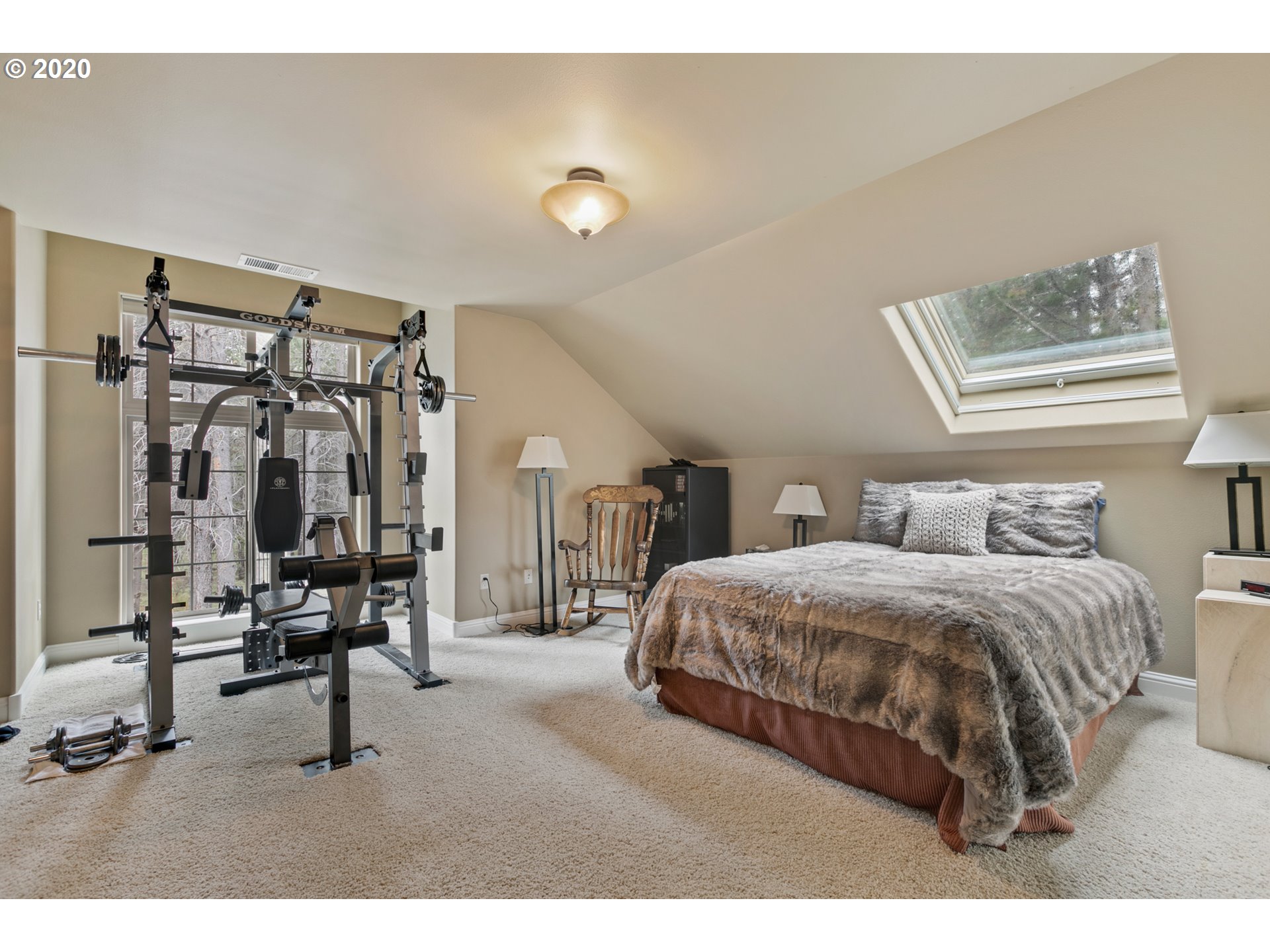 16767 Stage Stop Drive Bend, OR 97707 - Photo 21 of 26 a bedroom with a bed a desk and large mirror