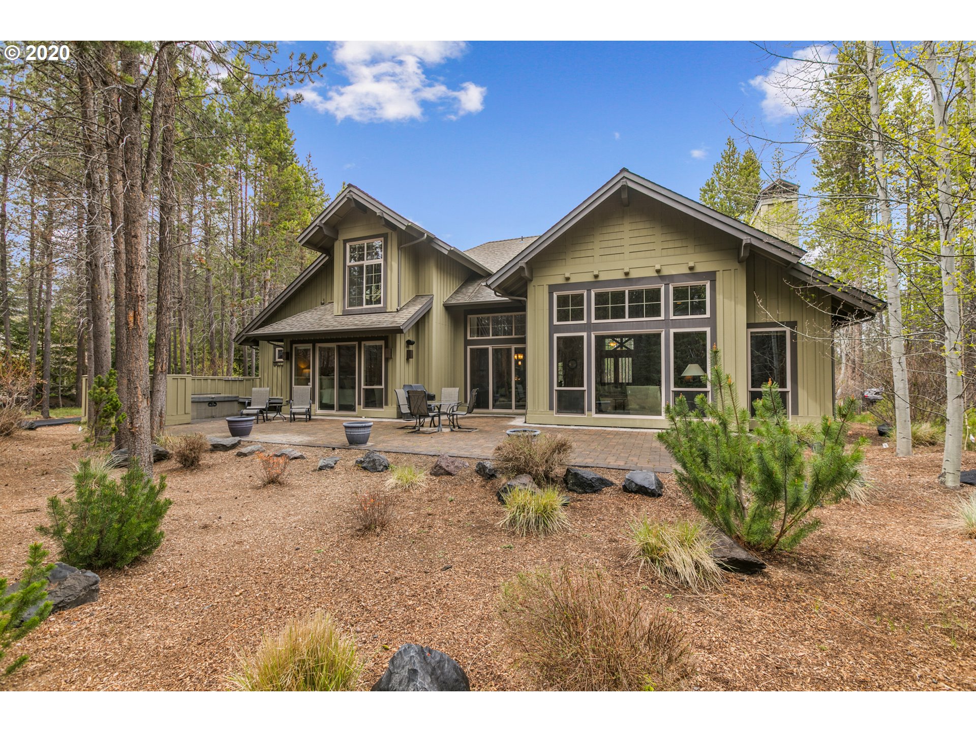 16767 Stage Stop Drive Bend, OR 97707 - Photo 24 of 26 a front view of a house with yard and green space