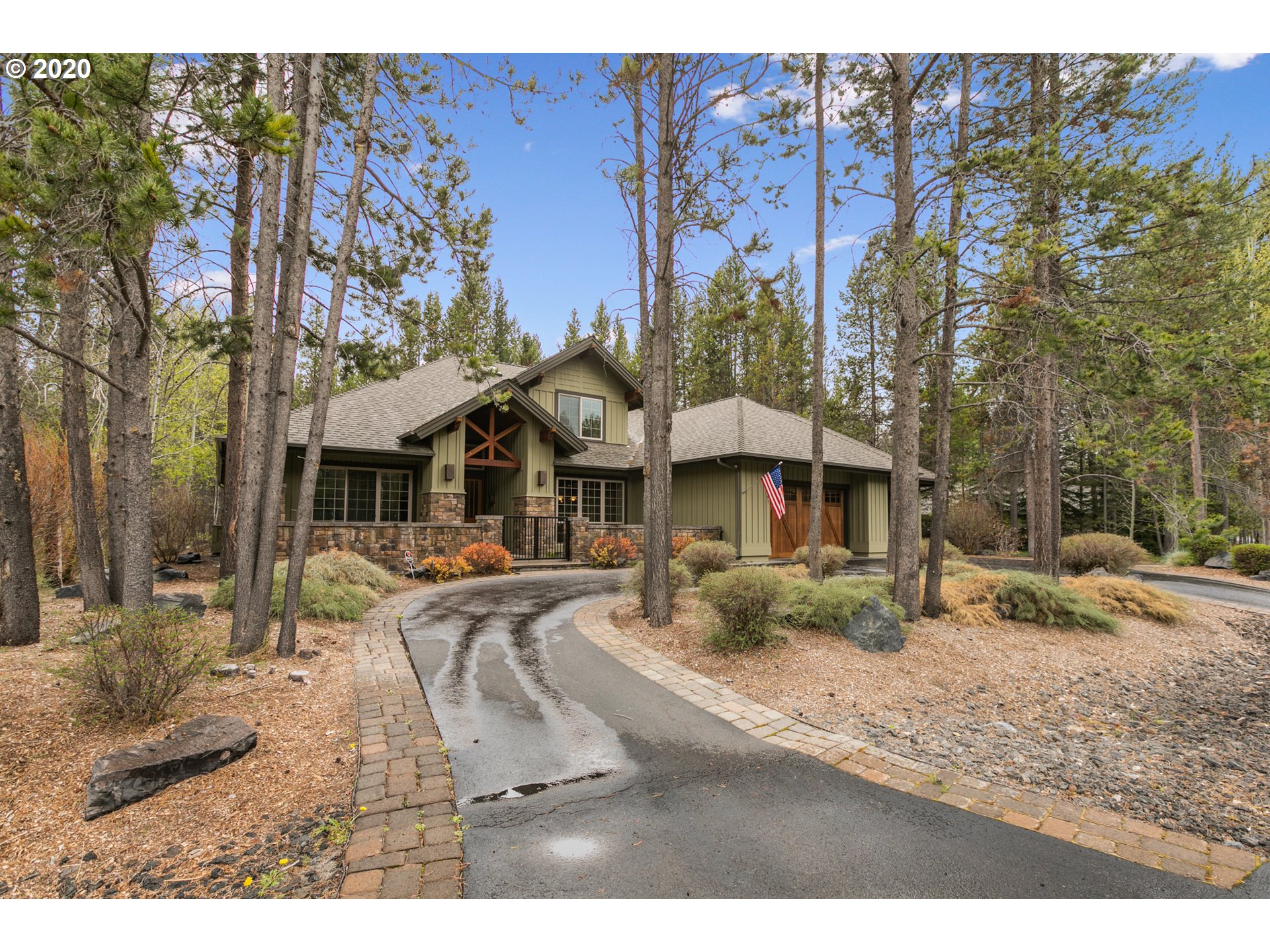 16767 Stage Stop Drive Bend, OR 97707 - Photo 3 of 26 a front view of a house with garden