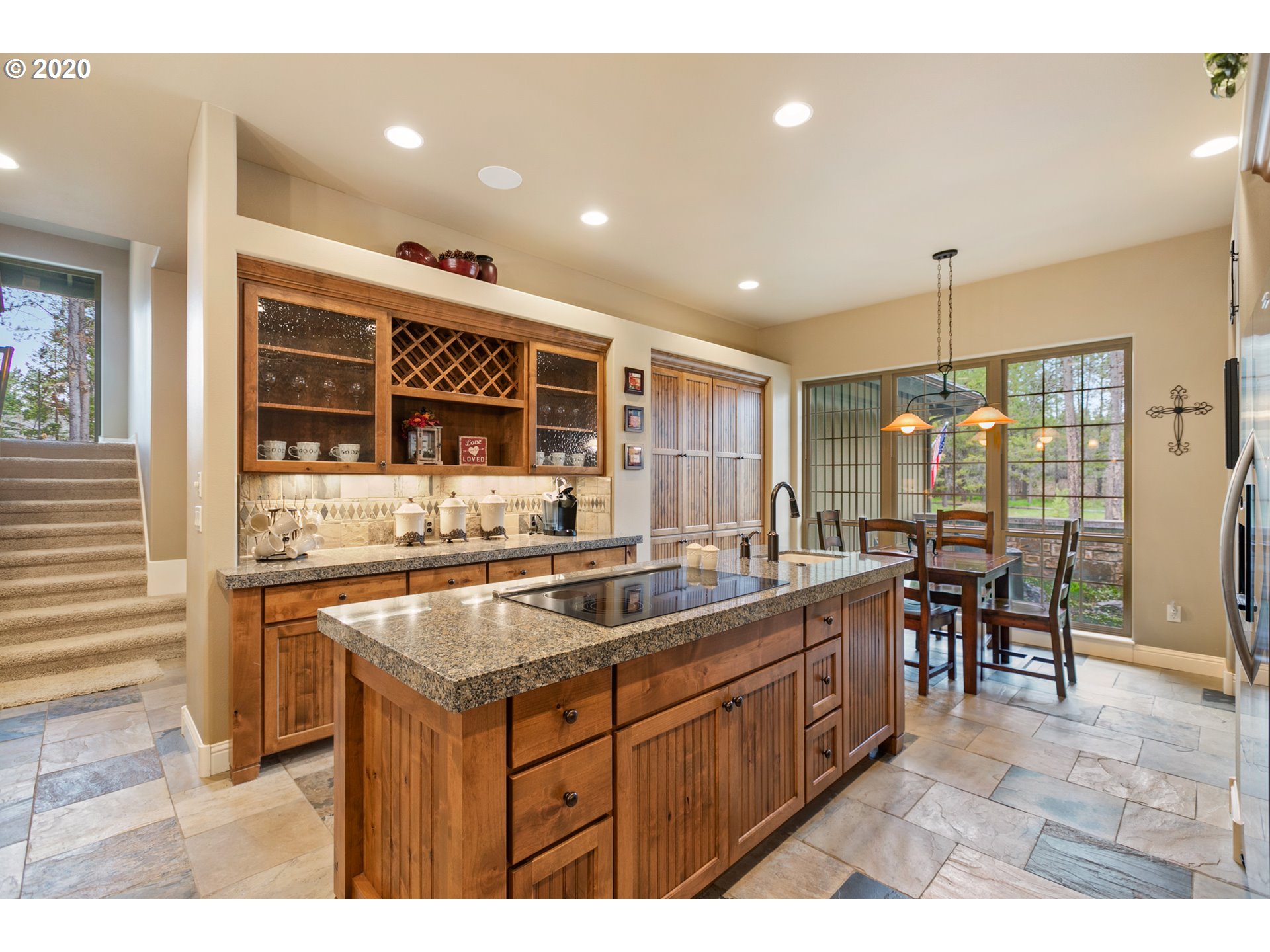 16767 Stage Stop Drive Bend, OR 97707 - Photo 7 of 26 a kitchen that has a sink and a stove in it