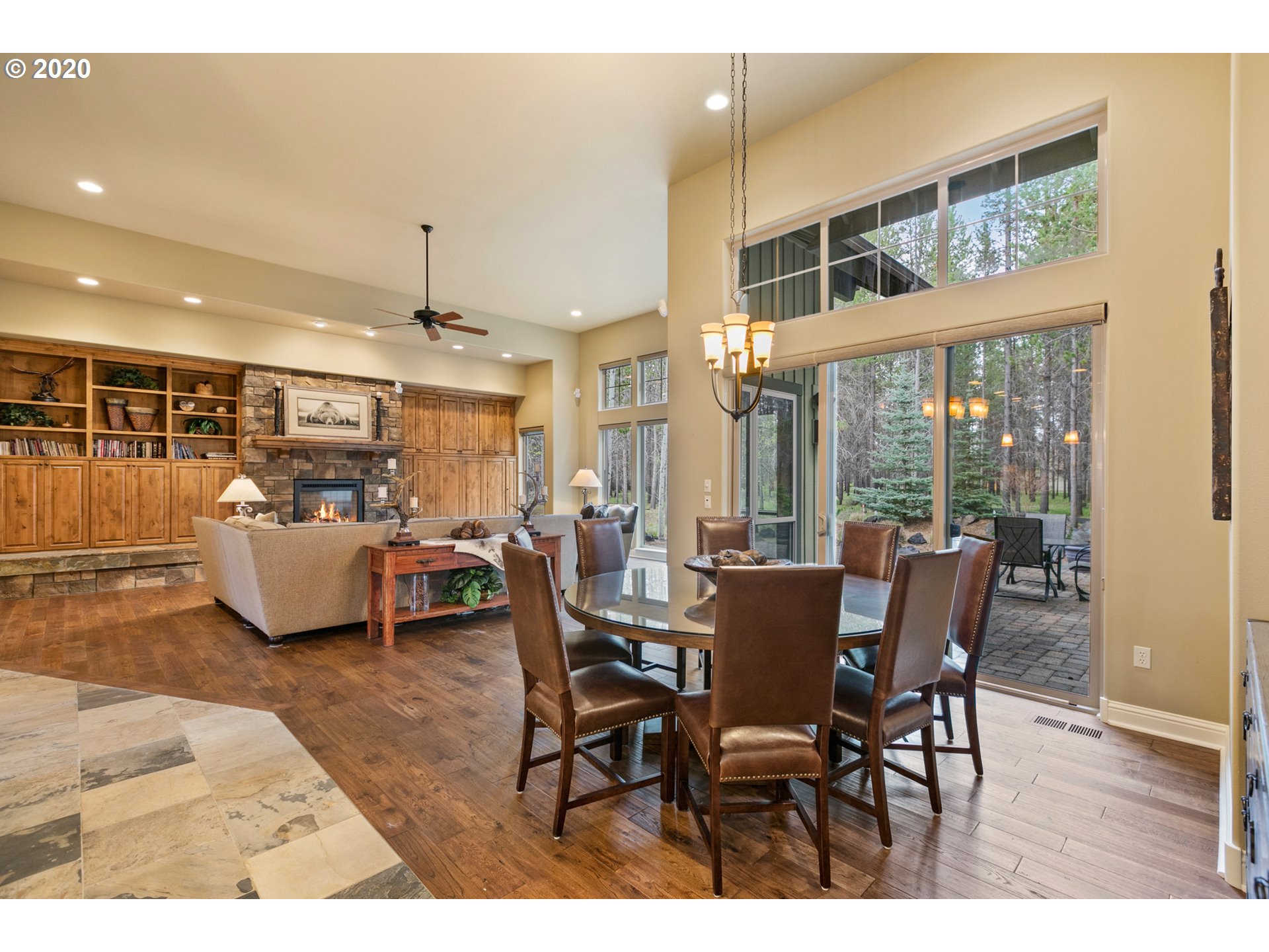 16767 Stage Stop Drive Bend, OR 97707 - Photo 10 of 26 a view of a dining room with furniture window and wooden floor
