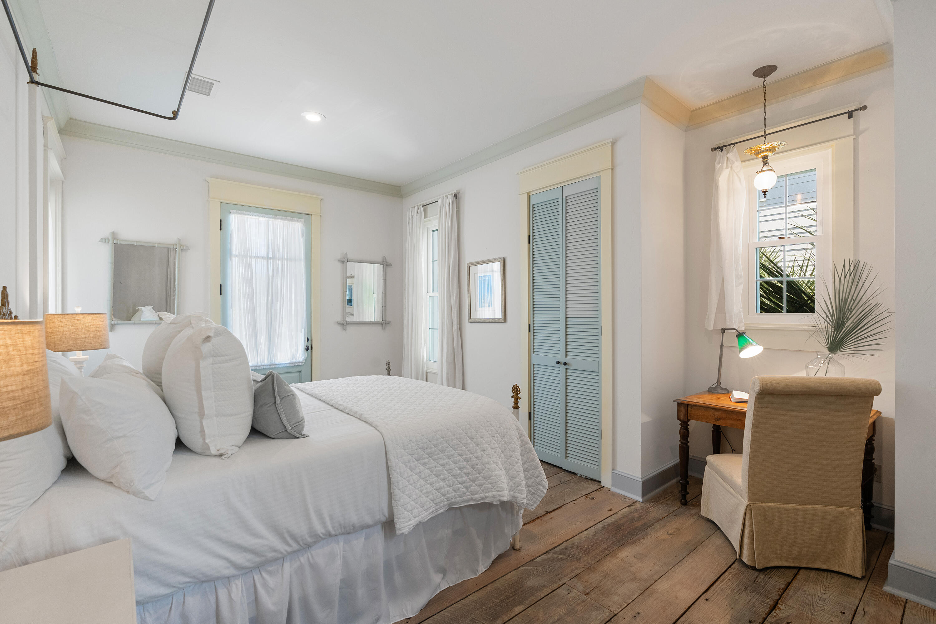 517 Eastern Lake Road Santa Rosa Beach, FL 32459 - Photo 23 of 53 a bedroom with a bed and a chair