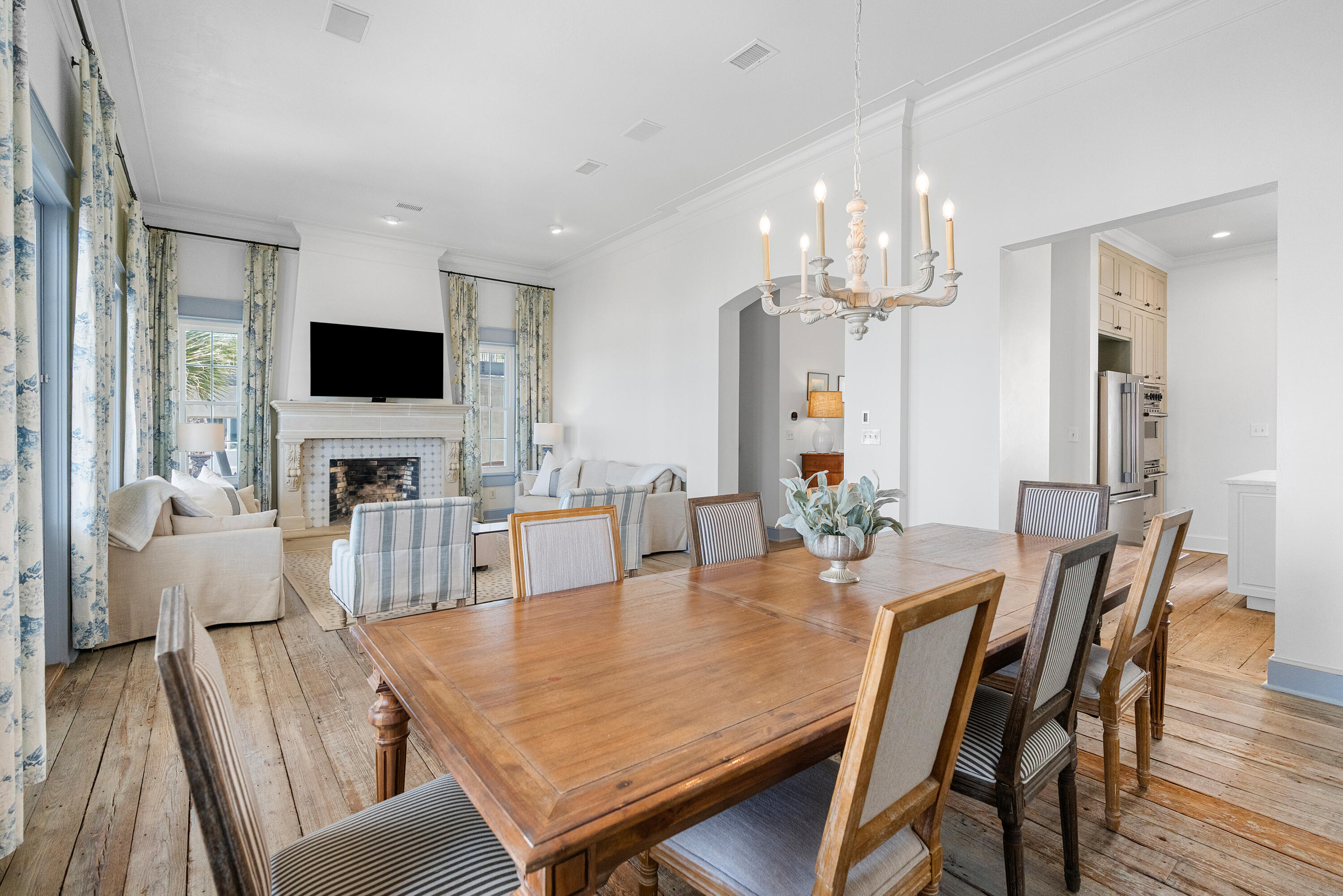 517 Eastern Lake Road Santa Rosa Beach, FL 32459 - Photo 40 of 53 a view of a dining room with furniture a chandelier and wooden floor