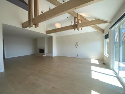 a view of a big room with closet and windows