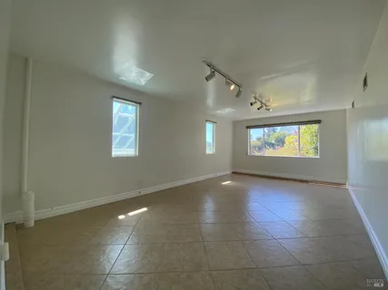 a view of an empty room and a window
