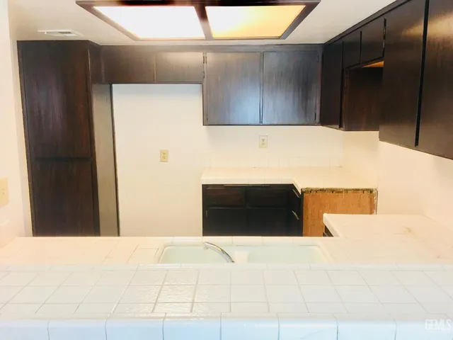 a kitchen with a sink and cabinets