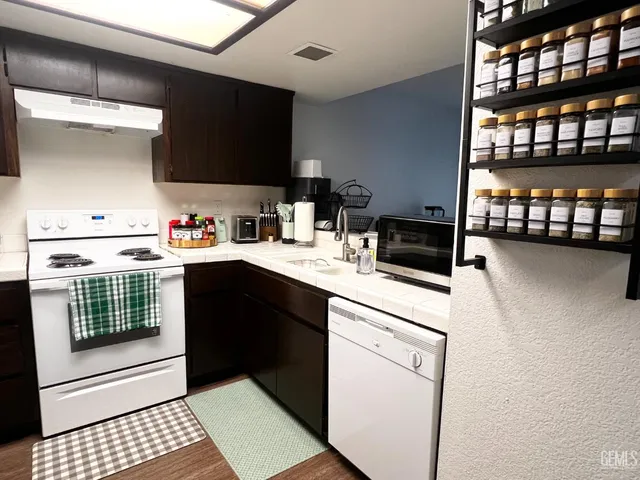 a kitchen with a stove and a microwave