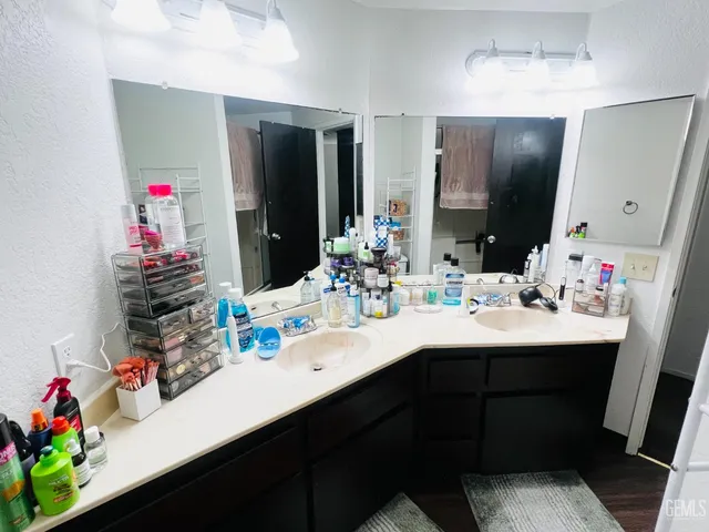 a bedroom with a bed and a tv