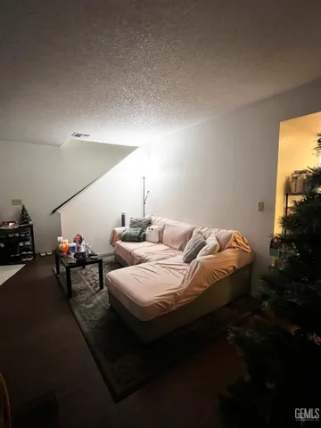 a living room with furniture and flowers
