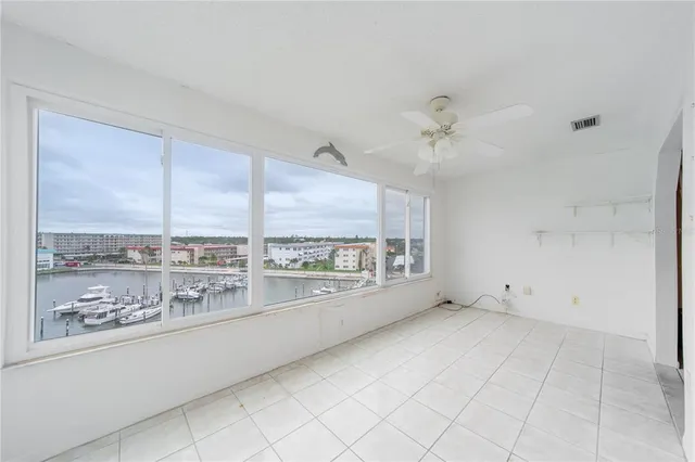 a view of an empty room with a window