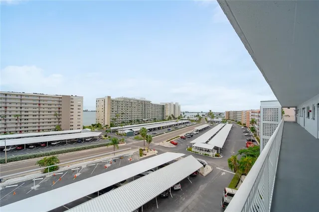 a view of city from balcony with seating space