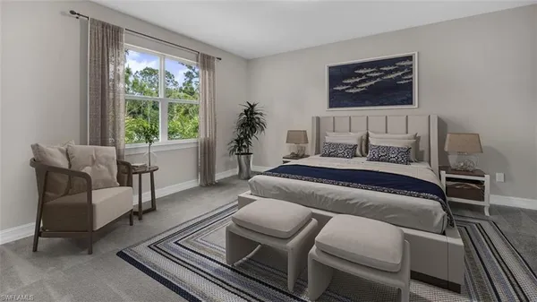 a bedroom with furniture and a window