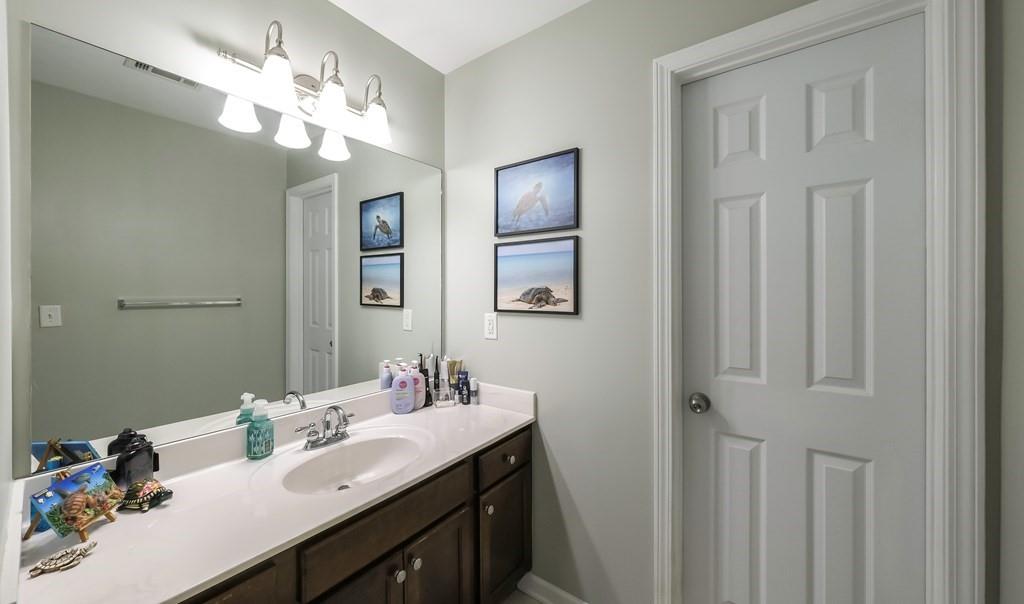 8680 Copperridge Drive Winston, GA 30187 - Photo 12 of 58 a bathroom with a sink vanity and a mirror