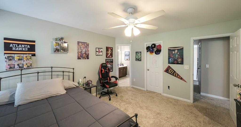 8680 Copperridge Drive Winston, GA 30187 - Photo 15 of 58 a living room with furniture and a flat screen tv
