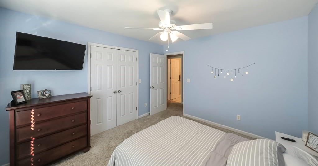 8680 Copperridge Drive Winston, GA 30187 - Photo 20 of 58 a bedroom with a bed and a flat screen tv
