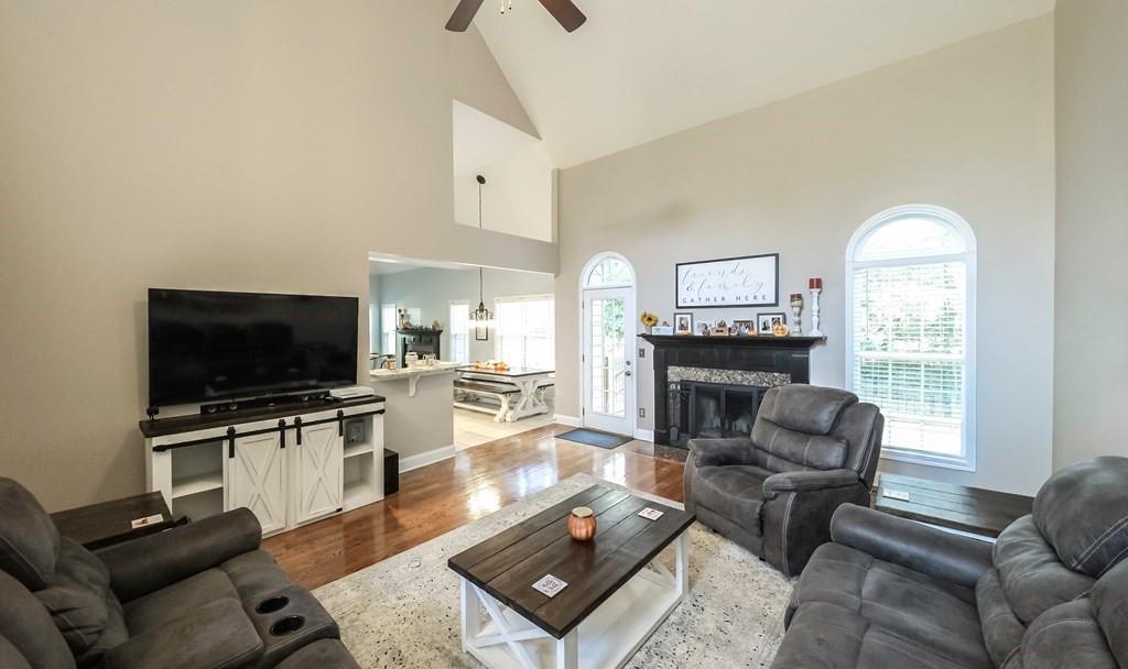 8680 Copperridge Drive Winston, GA 30187 - Photo 30 of 58 a living room with furniture and a flat screen tv