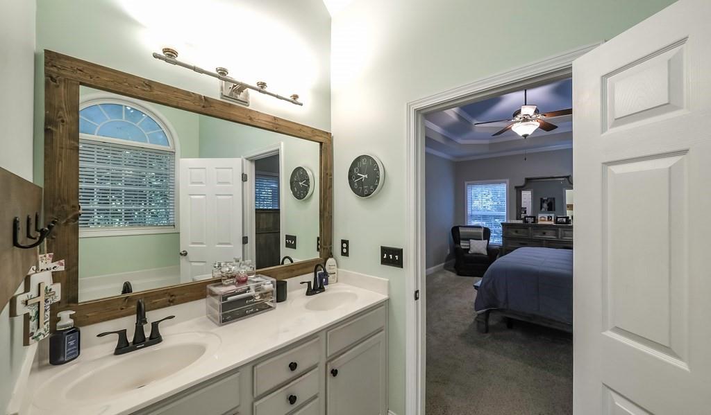 8680 Copperridge Drive Winston, GA 30187 - Photo 42 of 58 a en suite bathroom with 2 sink and a mirror