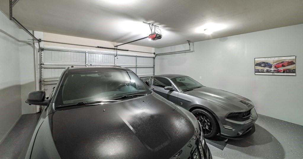 8680 Copperridge Drive Winston, GA 30187 - Photo 54 of 58 a bedroom with bed and a chandelier