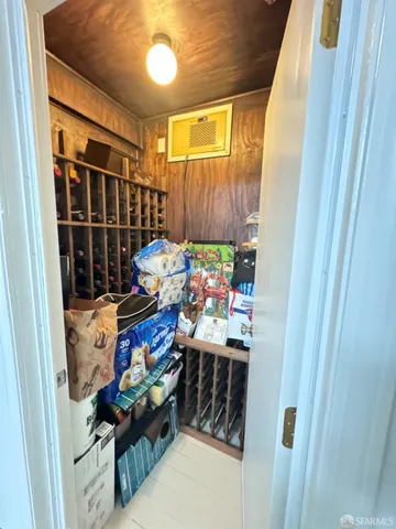 a living room with furniture pool table wooden floor and a table