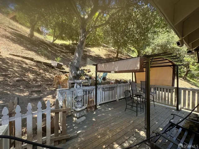 a balcony with trees in front of it