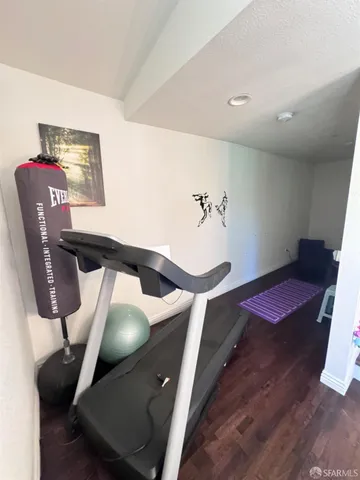 a room with pool table and windows