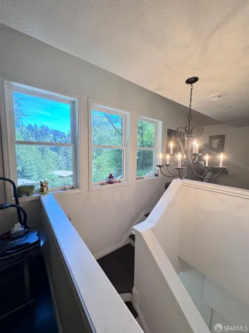 a white toilet sitting next to a bathroom sink and vanity