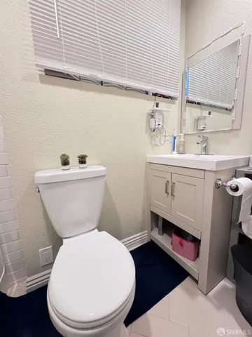 a bedroom with furniture wooden floor and a window