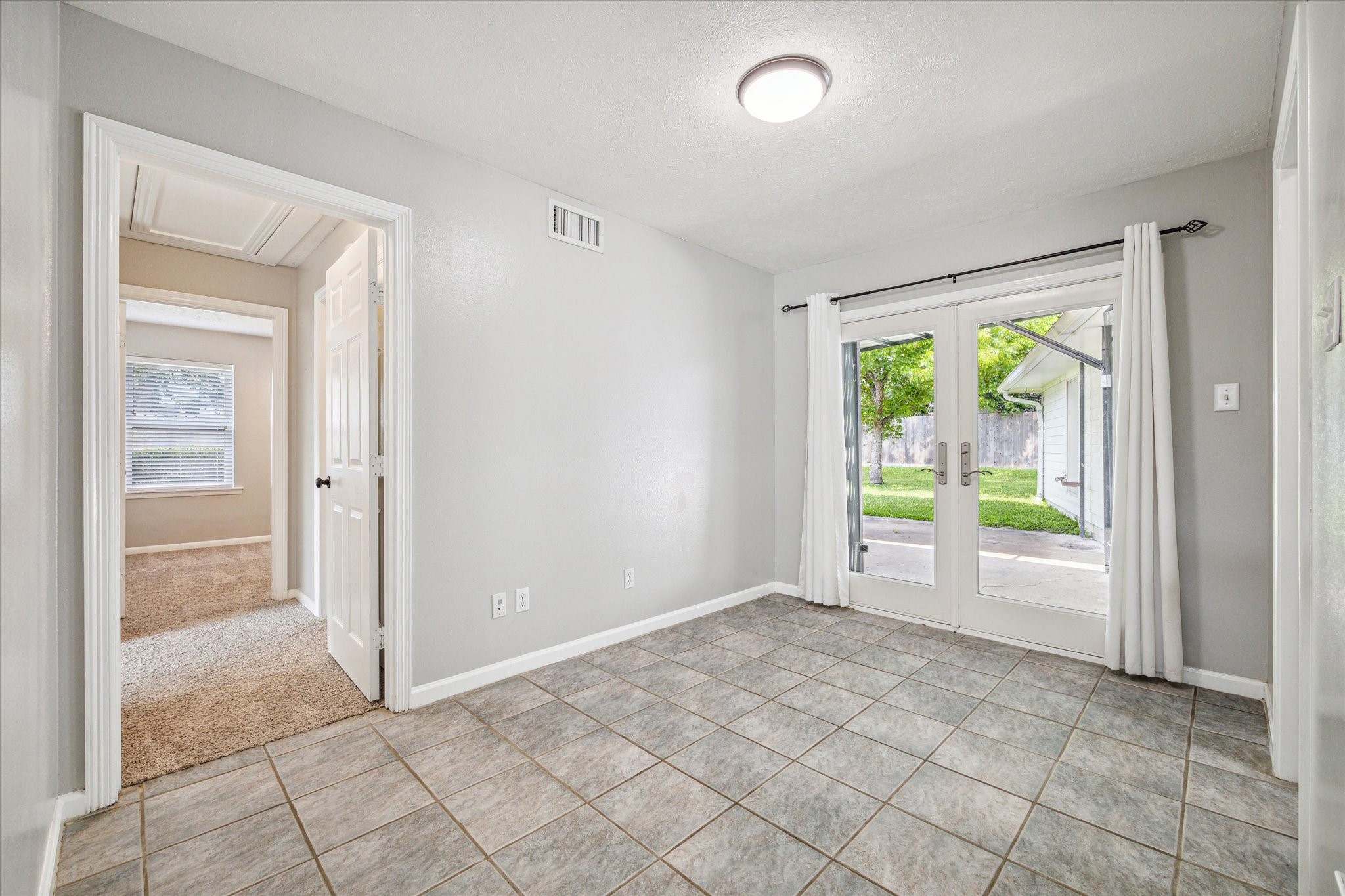 3613 Lazy Spring Drive Houston, TX 77080 - Photo 11 of 22 wooden floor in an empty room with a window